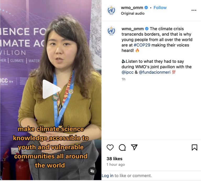 A person speaks at a climate event pavilion. Text on screen reads: "make climate science knowledge accessible to youth and vulnerable communities all around the world.